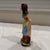 Vintage 1950’s hand painted folk art ceramic figurine made in Japan. Woman with scythe and bushel of wheat. 7.125" tall.