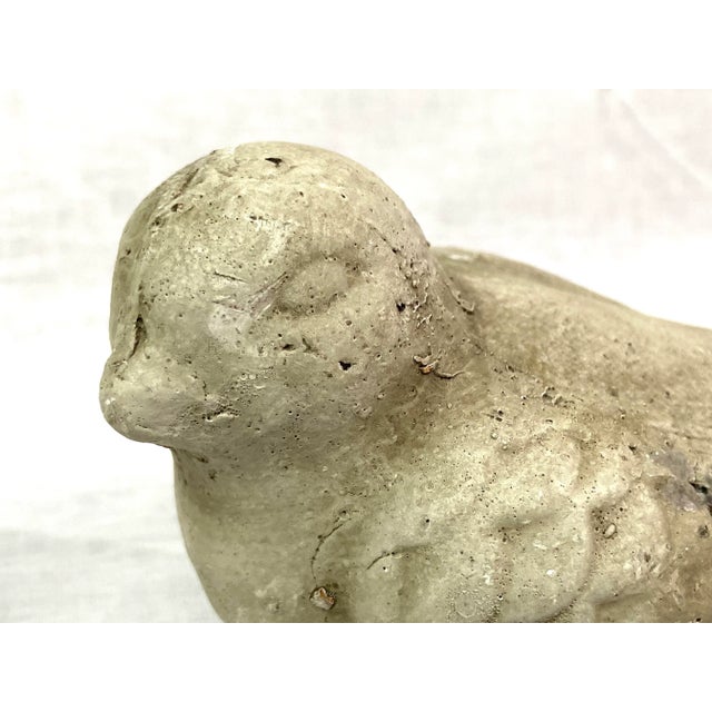 This cool bird sculpture is made out of a material. presenting as stone, with possible ceramic pottery. Dimensions: 5.5” w...