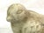 This cool bird sculpture is made out of a material. presenting as stone, with possible ceramic pottery. Dimensions: 5.5” w...