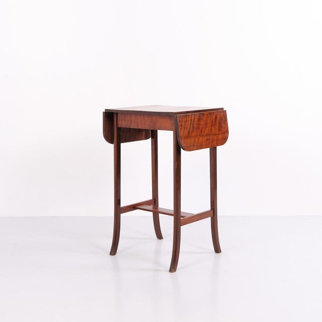 Danish side table crafted in mahogany with two drop leaves. Dating from the 1920s, the table can be used as a side table,...