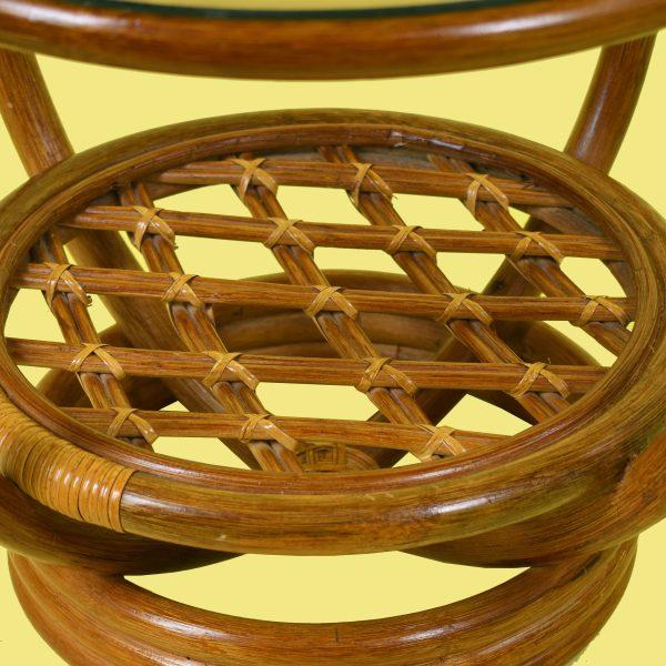 A charming pair of round rattan side tables with a warm, hand-woven character. The open-weave sides and tidy round tops...