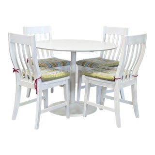 Cb2 White 5-Piece Round Dining Set With Cushioned Chairs For Sale