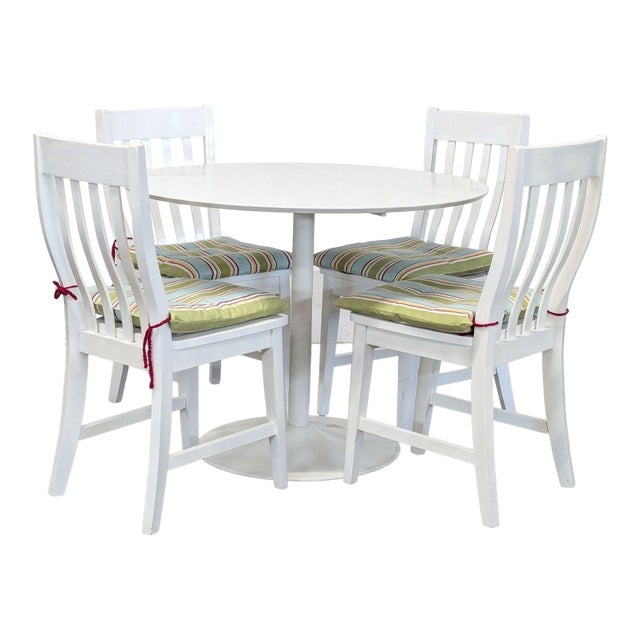 Cb2 White 5-Piece Round Dining Set With Cushioned Chairs For Sale
