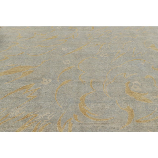 Hand-knotted in wool, this 12x14 modern rug represents the French Art Deco rug collection by Rug & Kilim. On the Design:...