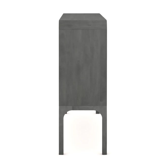 Art, music, and craftsmanship come together in the Toure Console Cabinet. Inspired by the fluid melodies of Malian...