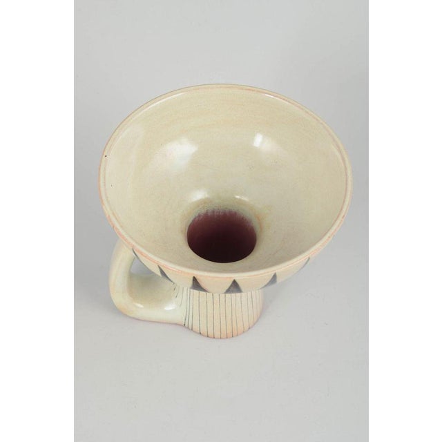 Carl-Harry Stålhane for Rörstrand Vase, 1960s. Sculptural stoneware vase with pronounced foot and side handle. Decorated...