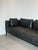 Elegant contemporary sofa by indera , upholstered in supple black leather. The sofa features a clean architectural...
