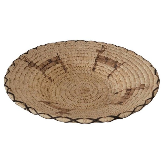 20thc Papago native American hand made basket with Papago label underneath. The hand woven basket is a pictorial basket...