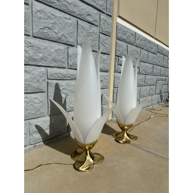 Striking pair of sculptural table lamps featuring dramatic, petal-form shades crafted from a translucent lucite-like...