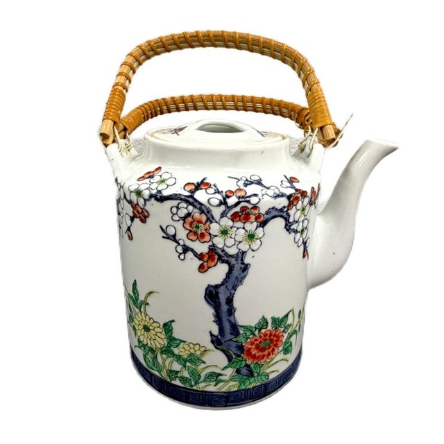 Vintage Japanese Imari Style Porcelain Dobin Teapot with Woven Rattan Handle Enhance your tabletop collection or curated...