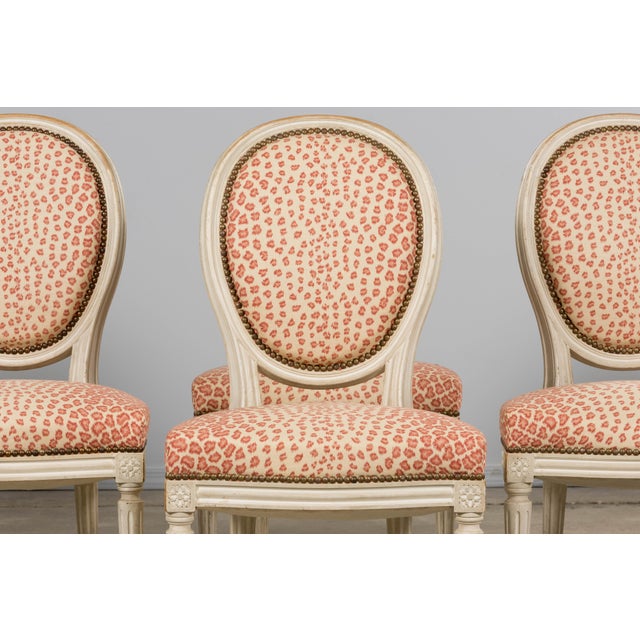 A refined set of six late-19th-century French Louis XVI style dining chairs, sourced in Paris. Each chair features the...