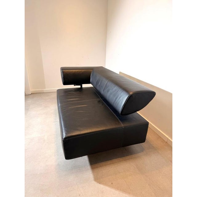 Impressive cor “arthe” modular sofa bed , upholstered in supple black leather and combining bold architectural design with...