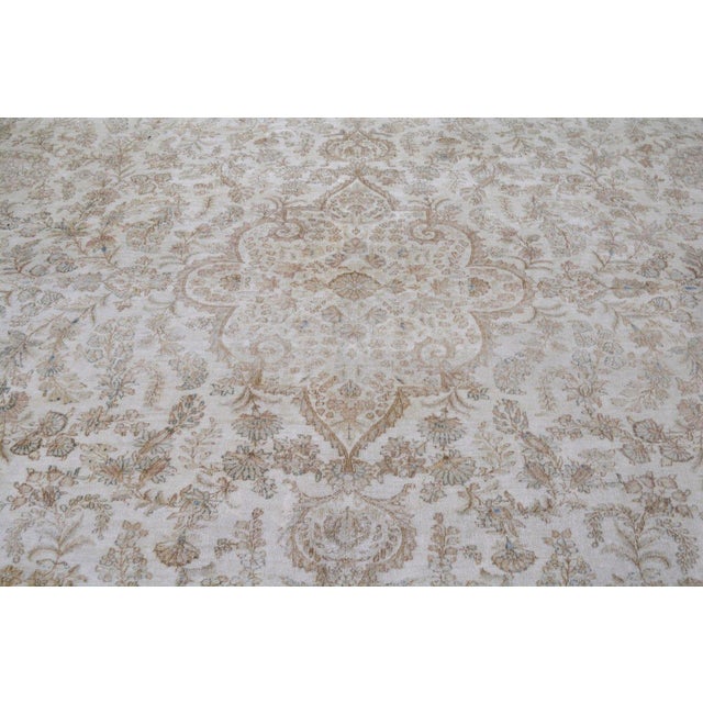 Hand-knotted with care using traditional rug-making techniques, this wool rug blends timeless craftsmanship with a modern...