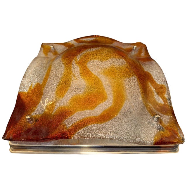 A striking Italian Murano glass wall sconce or ceiling flush mount by Mazzega, circa 1970's, showcasing the bold...