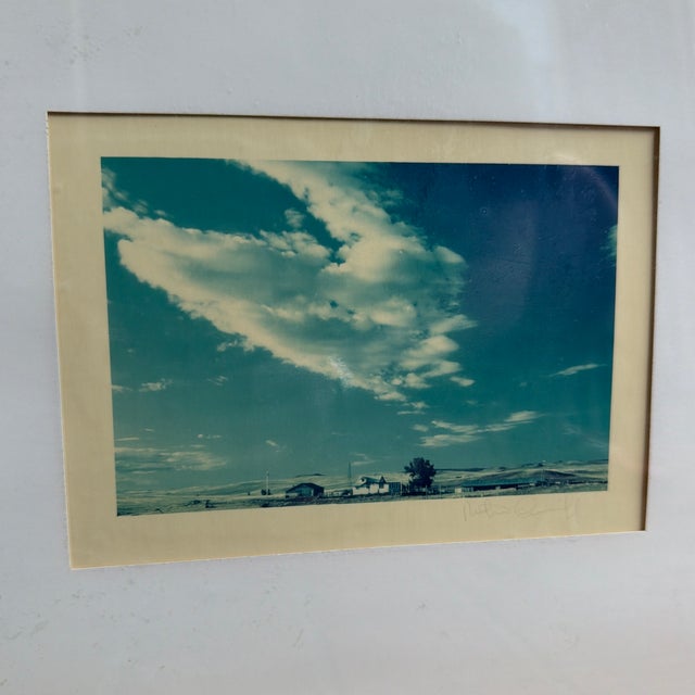 A diptych of color photos of the sky and a small coastal Texas town. Matted and framed. 11.25in x 14.25in