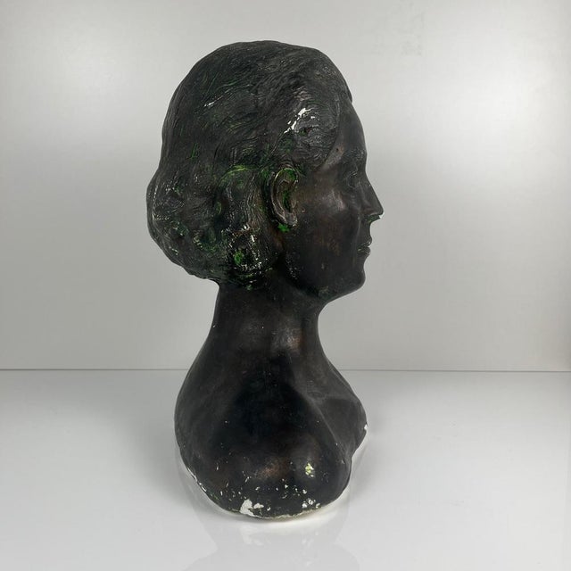 Neoclassical style plaster bust of a woman by M. Mongey, 20th century. Plaster with a bronze patina. Dimensions: 40 x 25...