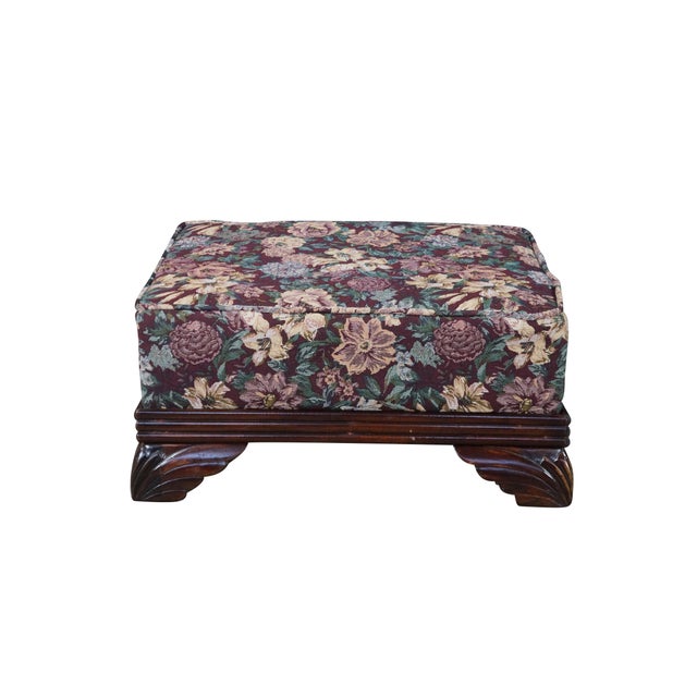 Pair of antique Victorian footstools or ottomans. Featuring vintage floral tapestry upholstery in muted tones of burgundy,...