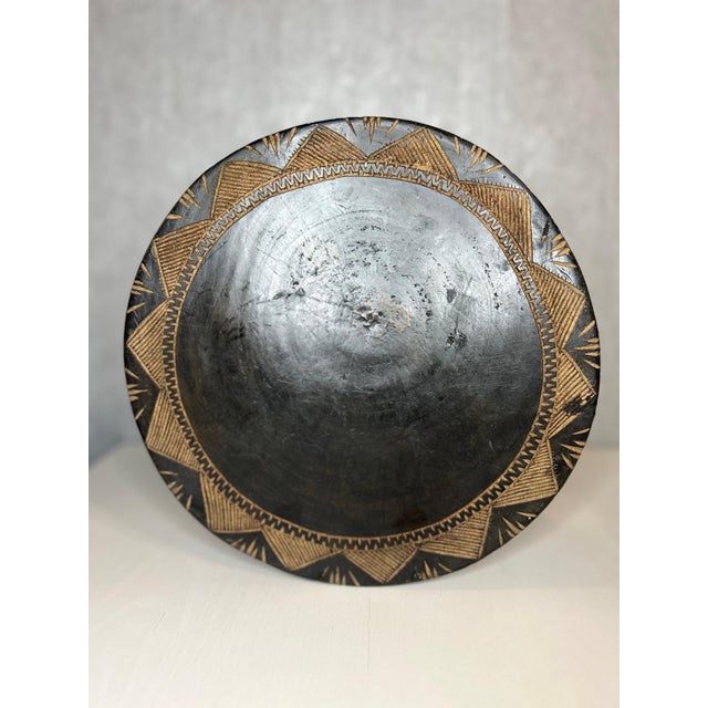 This Baga stool, crafted from solid wood and originating in Guinea, powerfully illustrates the sculptural dimension of...