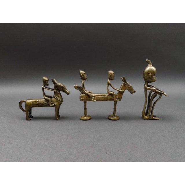 African Tribal Vintage Handmade Metal Figurines Set Of 3. Measures approximately: Horsemen: 5 7/8" long, 1 1/2" wide, 4...