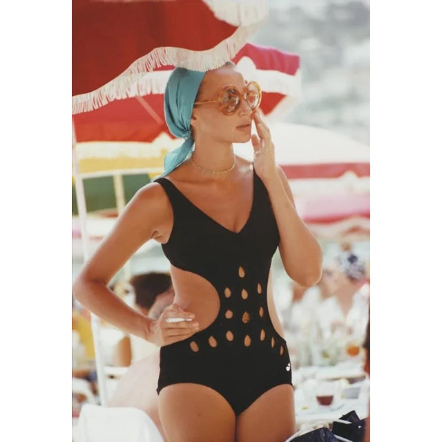 Monte Carlo Swimwear 1970 by Slim Aarons Slim Aarons Limited Estate Edition A woman in a cutaway swimsuit in Monte Carlo,...