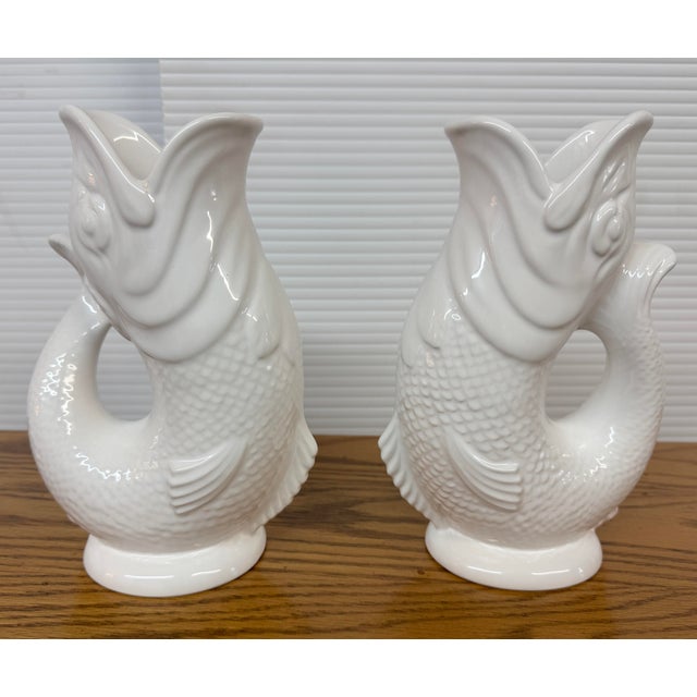 Design Plus Gallery presents a Pair of Fish-Shaped Jugs by Gluggle. Discover the timeless charm of the Gluggle Jug – a...