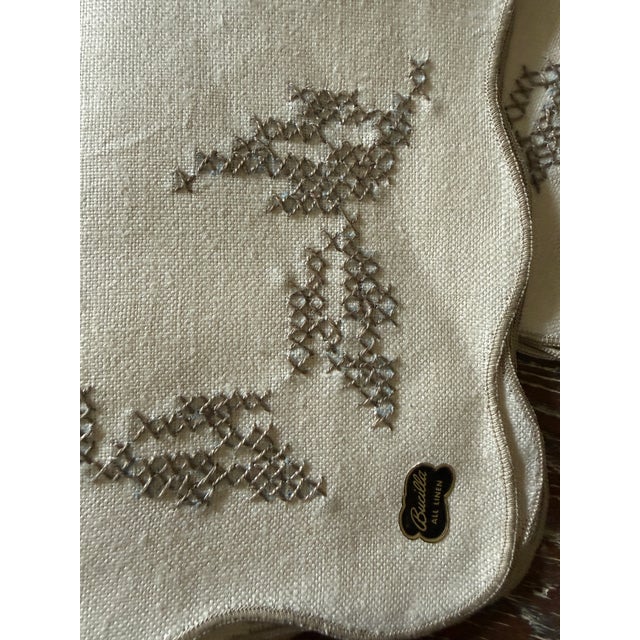 Elevate your table with this elegant set of four vintage Bucilla all linen luncheon napkins. Crafted from fine white...