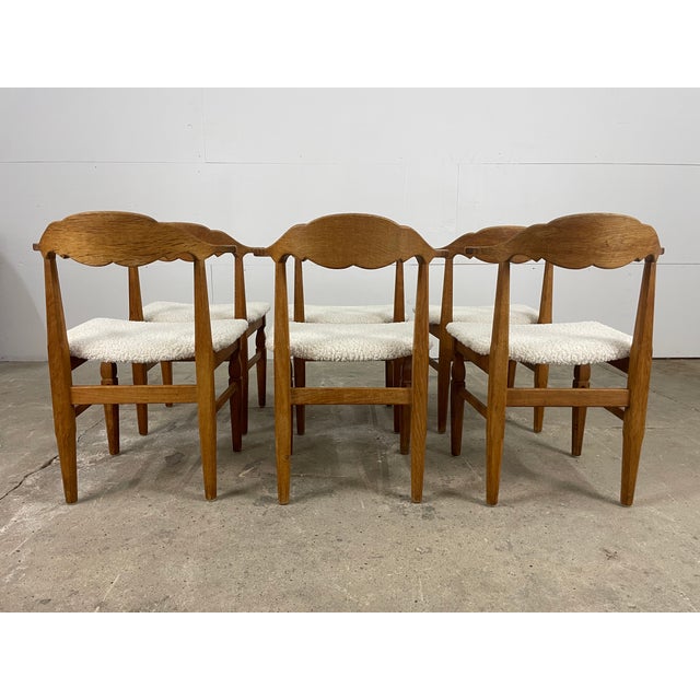 Set of six dining chairs designed by Henning Kjærnulf and produced by EG Kvalitetsmøbel in Denmark. Crafted in solid oak,...