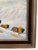 Vintage oil on canvas painting depicting a group of bison moving across a snow-covered landscape. The scene has a calm,...