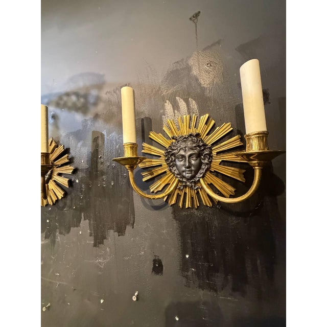 Circa 1930 French Louise XIV style bronze sunburst sconces with 2 lights