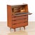 This fabulous mid century secretary desk was manufactured in Denmark during the 1960s. This striking cabinet has a warm,...