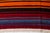 This is a vintage Turkish Oushak rug from the Mid 20th Century. The piece was hand-knotted.