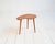 Shaped teak top, turned oak legs with brass tips. Scandinavian production from the 1950s and 1960s. The biomorphic...