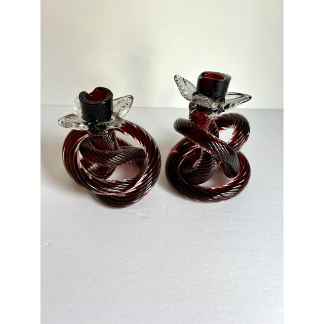 Unique pair of Hand Blown Glass Knot Candle Holders, beautiful deep burgundy color, original label attached. art at its...