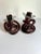 Unique pair of Hand Blown Glass Knot Candle Holders, beautiful deep burgundy color, original label attached. art at its...