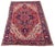 A beautiful antique Heriz carpet, handwoven circa 1920 with a large geometrical medallion on a terracotta field and deep...