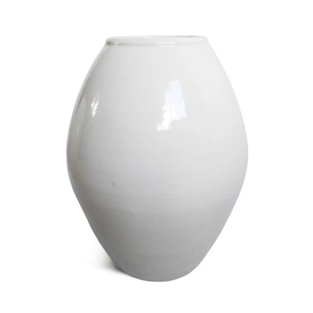 Beautiful vintage white milk oblong ceramic vase. Each may have slight handmade and natural differences and each is sold...