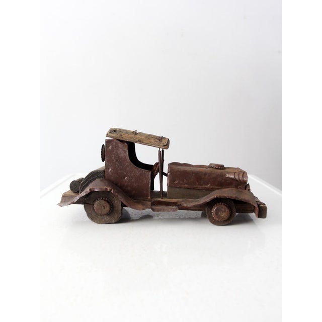 This is a handmade rustic style car. Modeled after cars from the early twentieth century it features the body made from...