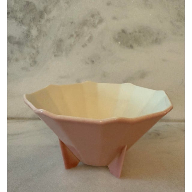 Vintage ceramic footed bowl with faceted shape and a beautiful dusty pink glaze made by Rockwood Pottery Company circa...