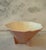 Vintage ceramic footed bowl with faceted shape and a beautiful dusty pink glaze made by Rockwood Pottery Company circa...