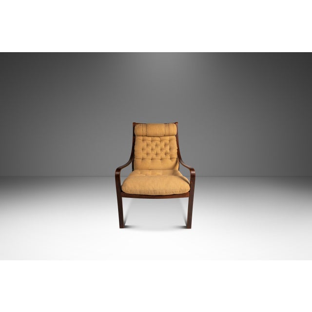 Introducing a rare high-back bentwood lounge chair in beech & original fabric by Fredrik A. Kayser for Vatne Møbler. In...