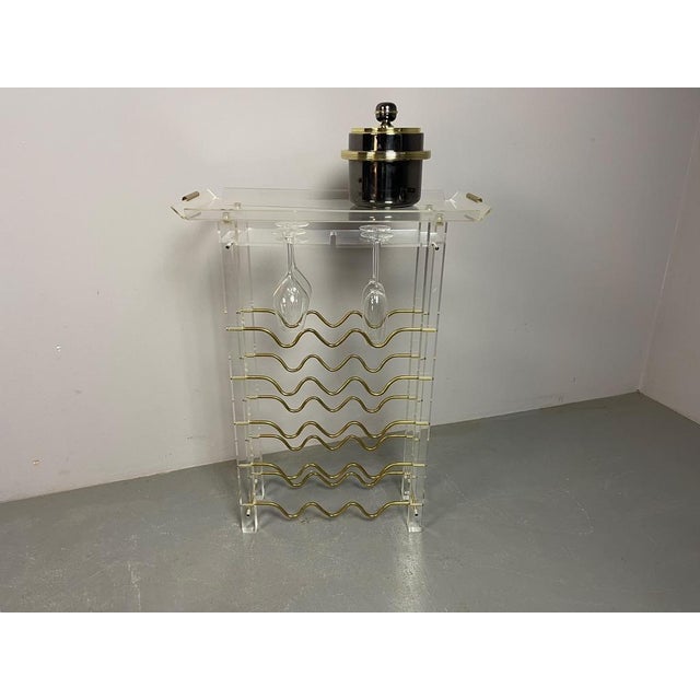 A rare and highly decorative vintage wine rack attributed to french designer david lange, dating from the 1970s. The...