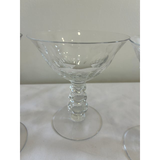 A refined set of three Duncan Miller “Juno” Champagne Coupes glasses, exemplifying mid-century American crystal...