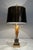 This pretty pineapple-shaped table lamp is made of black and gold lacquered metal. It is a French work in the style of...