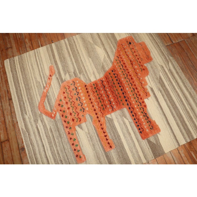 A Modern Souf Persian carpet depicting a lion on an abrashed gray and ivory colored field Details rug no. j3780 size 3'...