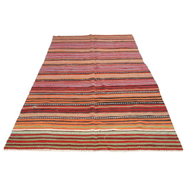 Handwoven vintage striped kilim rug from Denizli region of Turkey. Approximatelly 45-55 years old. In very good condition.