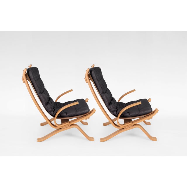 Original Focus sling lounge chairs, designed in the 1970s and manufactured by Bramin Møbler in Denmark. The bent plywood...