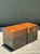 This striking pair of Postmodern drinks tables is a masterclass in material contrast and geometric form. Each table...
