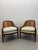 An elegant pair of Baker Furniture barrel lounge chairs crafted from richly finished walnut with beautifully handwoven...