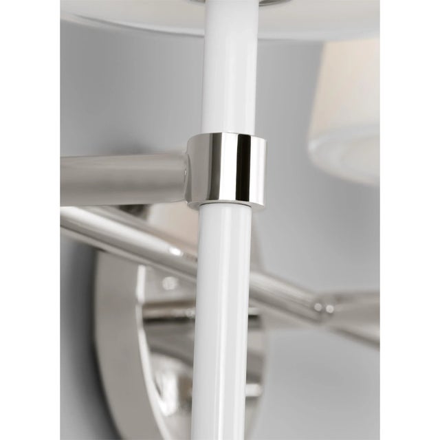 The Monroe three light vanity is inspired by graphic enameled metal jewelry and decorative accessories from kate spade...