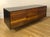 BDDW Lake Credenza Designed by Tyler Hays Graphite lacquer exterior / Claro walnut front Hand-carved ebony handles...